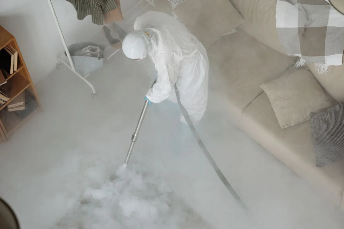 Biohazard cleanup technician in protective equipment, Dalhart, TX